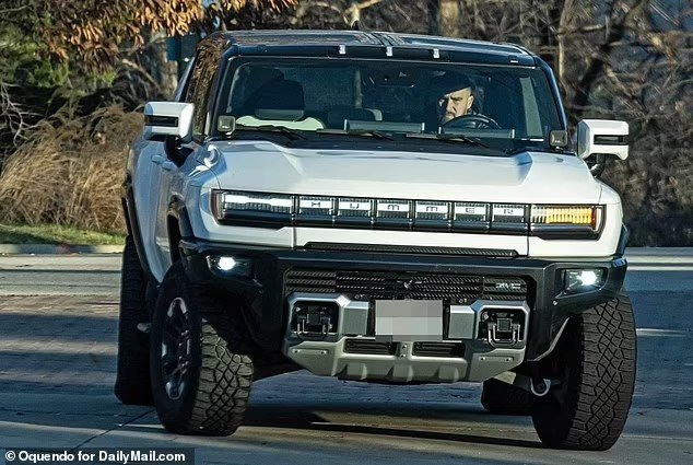 Travis Kelce and Taylor Swift enjoy a New Year's Day drive the morning after their passionate kiss at a glitzy party as the couple head to the Chiefs star's other house in Kansas City