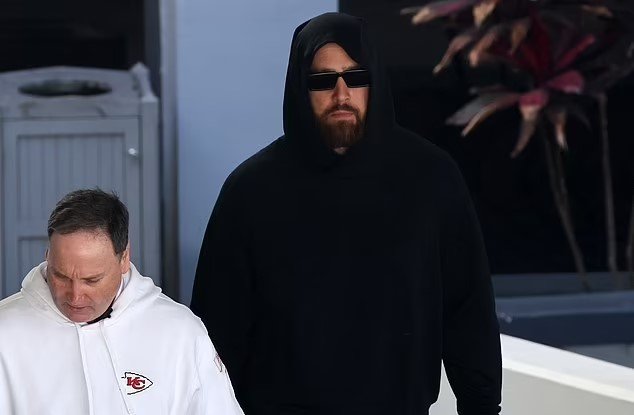 Travis Kelce looks glum in all-black en route to SoFi Stadium with Patrick Mahomes as his seven-season streak of 1,000-plus receiving yards comes to an end after Chiefs rule the star OUT - while girlfriend Taylor Swift prepares for the Golden Globes