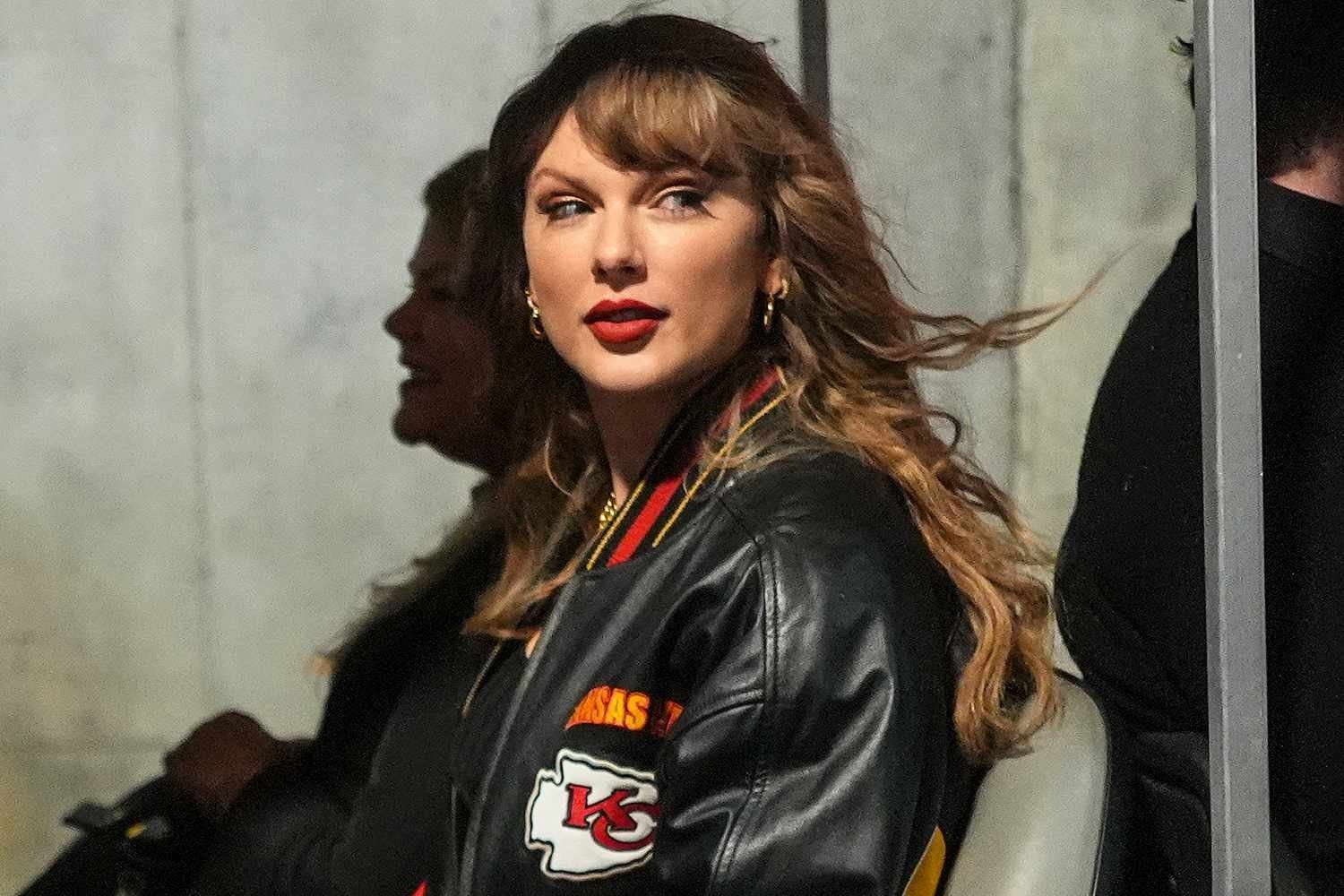 Taylor Swift Arrives at Chiefs vs. Bills Game in a Black Kansas City Chiefs Jacket, Flashing a Beaming Smile