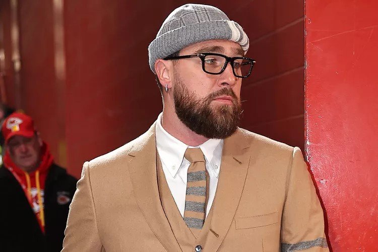 Travis Kelce Goes Tortured Poets-Chic in Thick Glasses and Tight Suit Ahead of AFC Championship