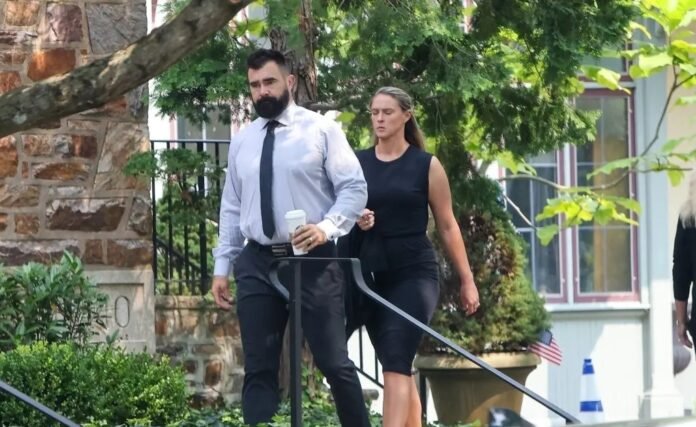 Jason and Kylie Kelce Heavily Criticized for Their Appearance at Ed Kelce’s Girlfriend’s Funeral — Fans Say They Looked Unkempt and Angry to Be There.
