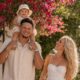 Patrick Mahomes and his gorgeous family enjoying a perfect sunny day together! Under a canopy of vibrant pink bougainvillea flowers, NFL superstar Patrick Mahomes walks hand-in-hand with his beautiful wife Brittany and their three precious children