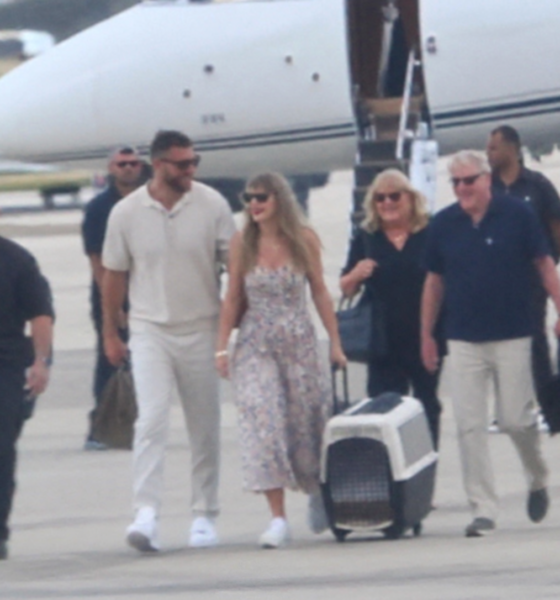 Travis Kelce and Wife Taylor Swift Arrive in Florida With Her Parents Andrea and Scott Swift on Taylor’s Private Jet in New Photos Ahead of the Chiefs vs. Dolphins Game, But a New Photo of Taylor Carrying a Custom Travel Carrier for Their New Samoyed, Wendy, Has Fans Asking the Same Question: Will She Break NFL and Stadium Protocol and Bring Their Pet to the Game?