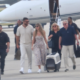 Travis Kelce and Wife Taylor Swift Arrive in Florida With Her Parents Andrea and Scott Swift on Taylor’s Private Jet in New Photos Ahead of the Chiefs vs. Dolphins Game, But a New Photo of Taylor Carrying a Custom Travel Carrier for Their New Samoyed, Wendy, Has Fans Asking the Same Question: Will She Break NFL and Stadium Protocol and Bring Their Pet to the Game?