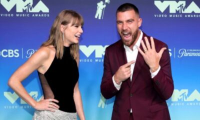 Taylor Swift’s Husband Travis Kelce Steals the Spotlight on the VMAs Red Carpet, Recreates Taylor’s Internet Breaking Meme and Proudly Points to His Wedding Ring as He Shouts “That’s My Wife!” After Making a Stunning Arrival to Support Her as She Receives the Inaugural MTV VMA Artist Directors Honors