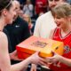 First Glimpse of Taylor Swift’s Heartwarming Reaction as Caitlin Clark Personally Gifts Her a Custom Eras Tour Theme Signature “Caitlin 1” Nike Sneaker Before Fever Aces Playoffs Game 3